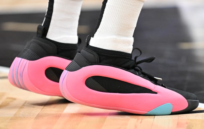 Los Angeles Clippers guard James Harden's black and pink adidas sneakers.